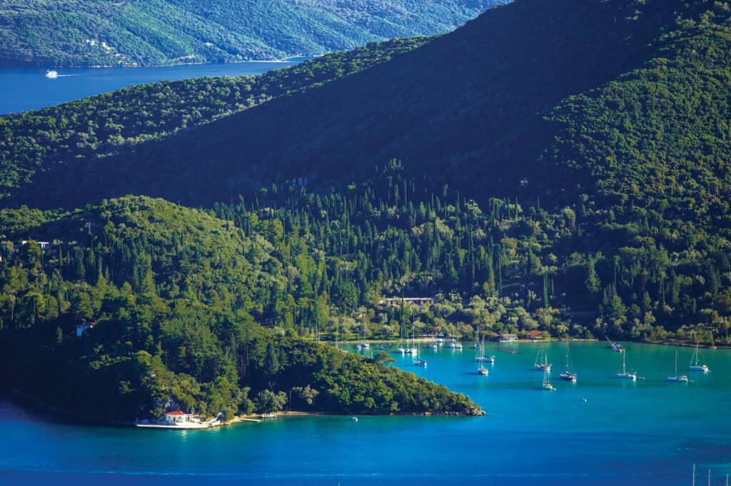 Beautiful view of Lefkada's lush green mountains and turquoise waters.